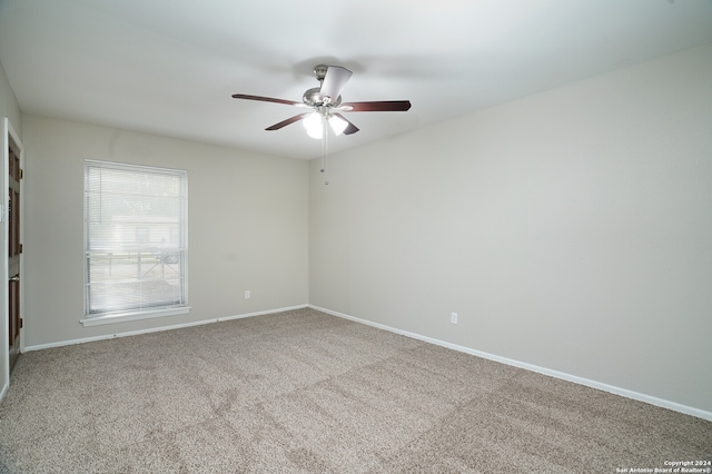 carpeted empty room with ceiling fan