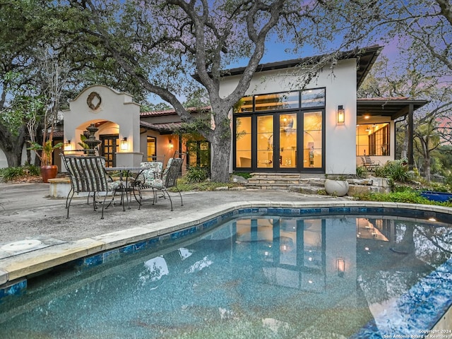 back of house featuring a patio area