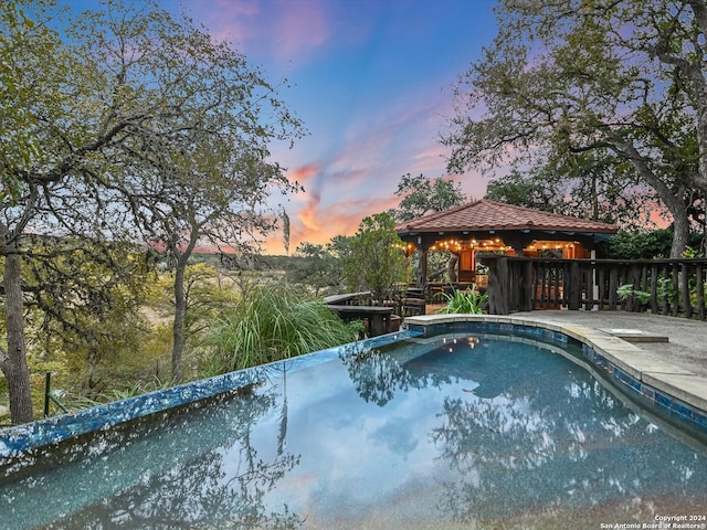 pool at dusk with a diving board