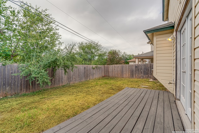 wooden deck with a yard