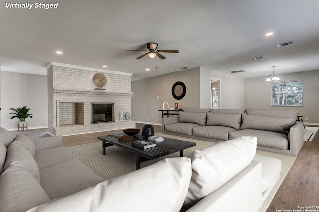 4103 Midvale Dr, San Antonio, TX 78229 - living room with baseboards, wood finished floors, ceiling fan, recessed lighting, and a fireplace
