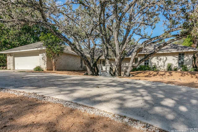 single story home featuring a garage