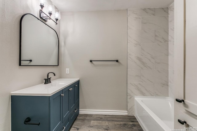4103 Midvale Dr, San Antonio, TX 78229 - full bathroom with vanity, wood finished floors, and baseboards