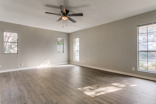 spare room featuring ceiling fan and hardwood / wood-style flooring