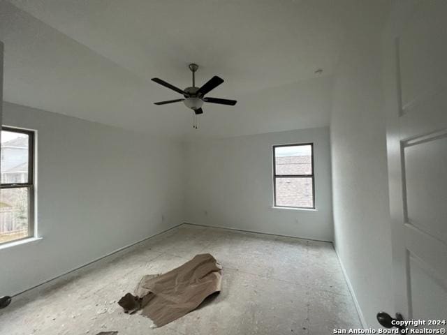 unfurnished room with ceiling fan