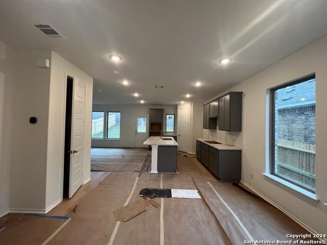 kitchen with a kitchen breakfast bar and a center island