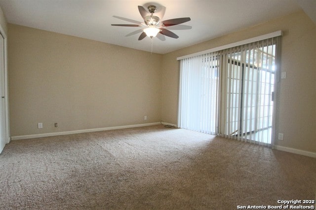 unfurnished room with carpet floors and ceiling fan