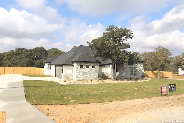 view of front of home with a front yard