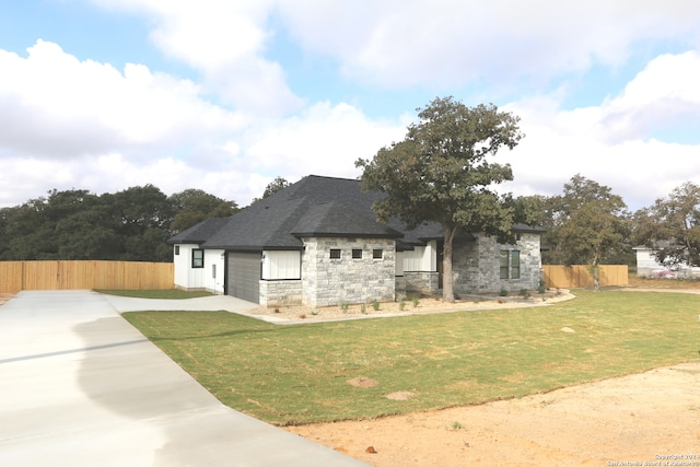 view of home's exterior with a lawn and a garage