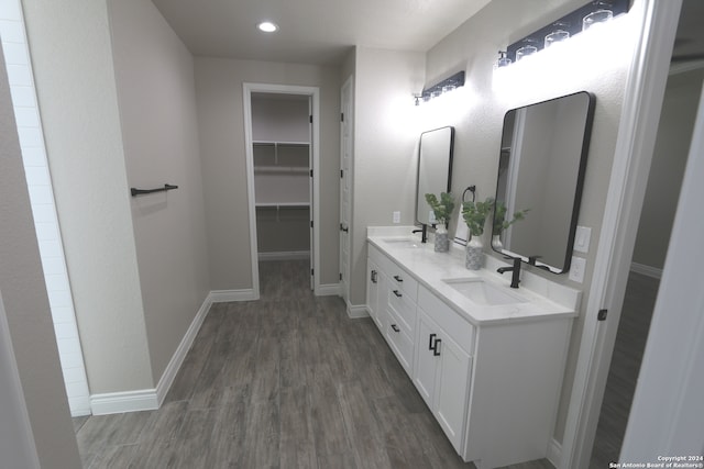 bathroom with vanity and hardwood / wood-style flooring