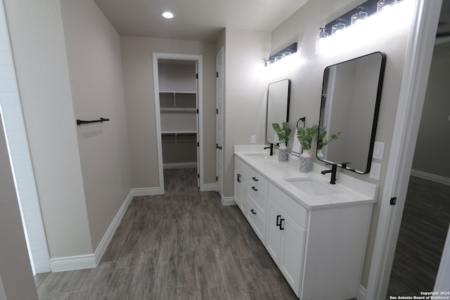 bathroom featuring vanity and hardwood / wood-style flooring