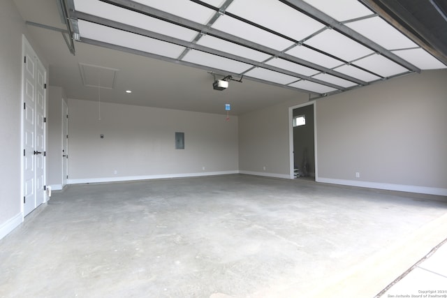 garage featuring electric panel and a garage door opener