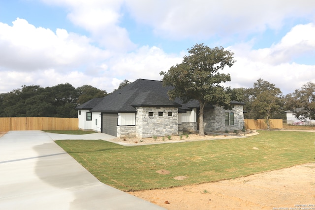 view of property exterior with a yard and a garage