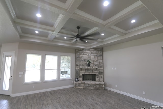 unfurnished living room with beamed ceiling, hardwood / wood-style floors, ceiling fan, and coffered ceiling