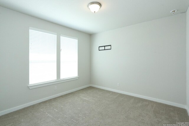 11514 Hollering Pass, Schertz, TX 78154 - carpeted empty room featuring baseboards