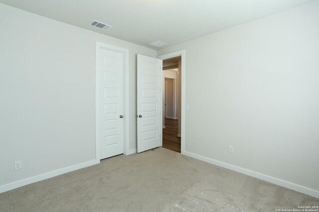 11514 Hollering Pass, Schertz, TX 78154 - unfurnished bedroom featuring carpet floors and baseboards