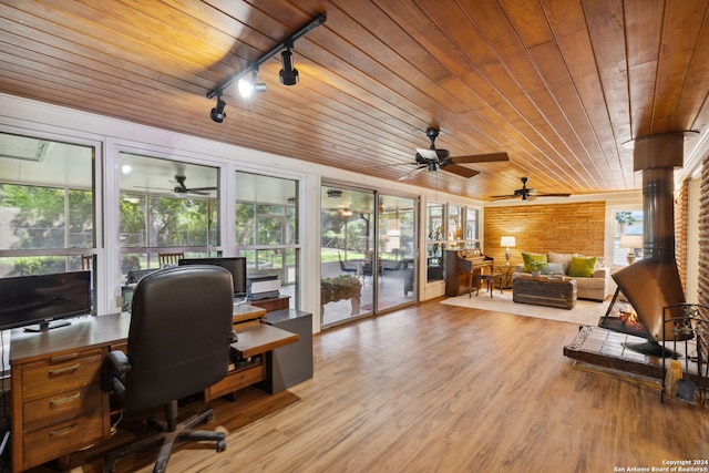 office space with a wealth of natural light, wood ceiling, and light hardwood / wood-style floors