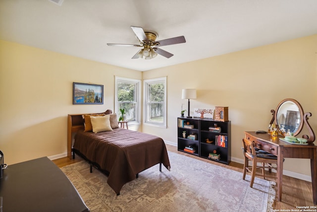 bedroom featuring light hardwood / wood-style flooring and ceiling fan