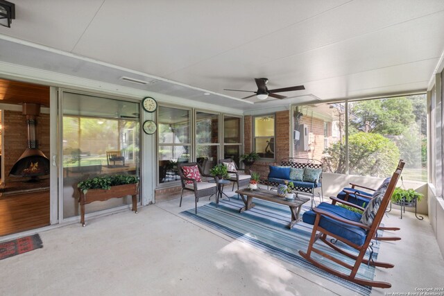 sunroom featuring ceiling fan