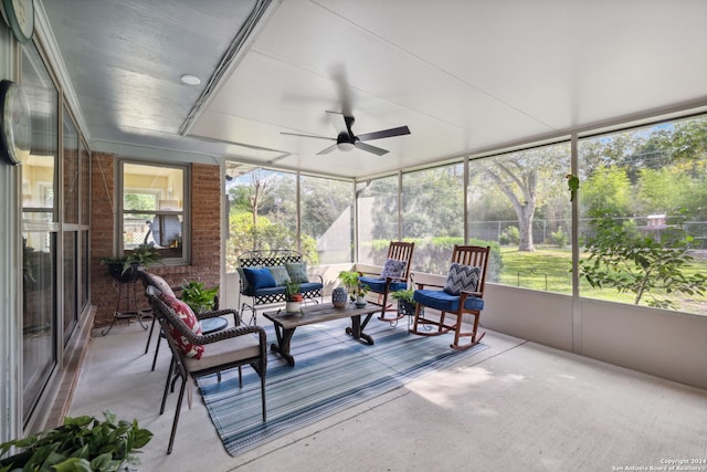 sunroom / solarium featuring ceiling fan