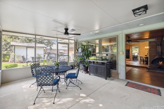 sunroom / solarium with ceiling fan