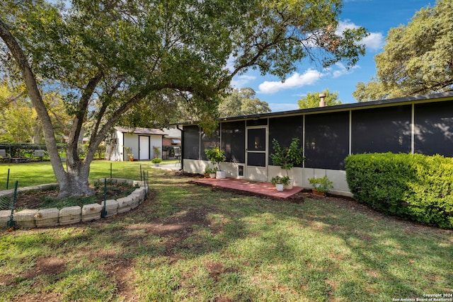 view of yard featuring a sunroom