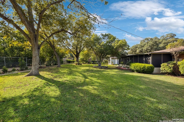 view of yard featuring a sunroom