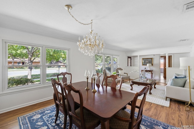 dining room featuring a chandelier and hardwood / wood-style flooring