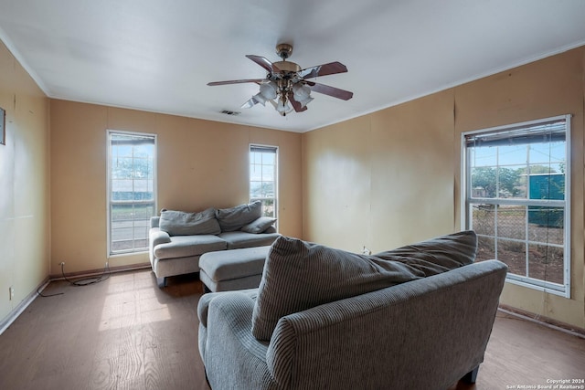 522 Ave B, Poteet, TX 78065 - living area with wood finished floors, ceiling fan, and baseboards