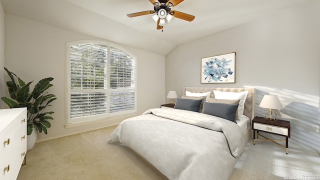 carpeted bedroom with ceiling fan and vaulted ceiling