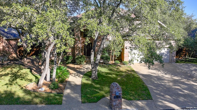 view of front of property with a garage and a front yard