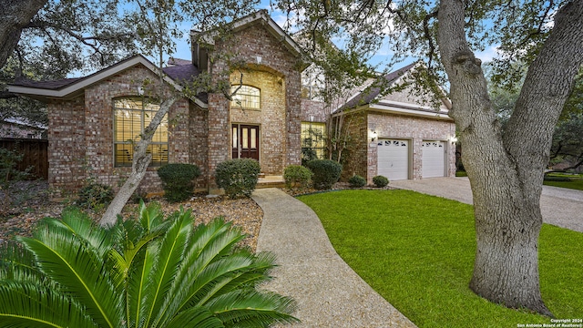 view of front of property with a front lawn and a garage