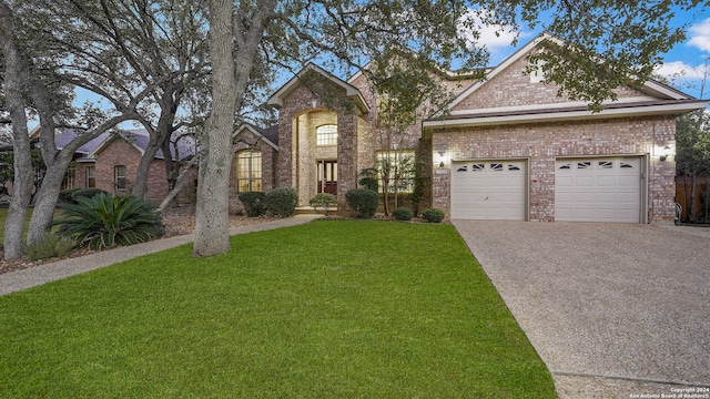 view of front facade featuring a front lawn and a garage