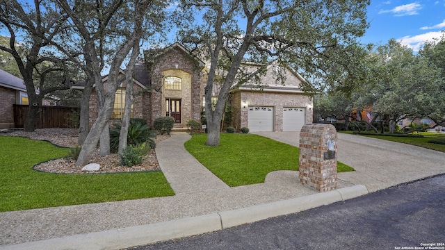 view of front of house featuring a garage and a front yard