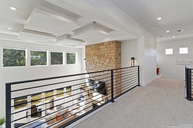 hallway with light colored carpet