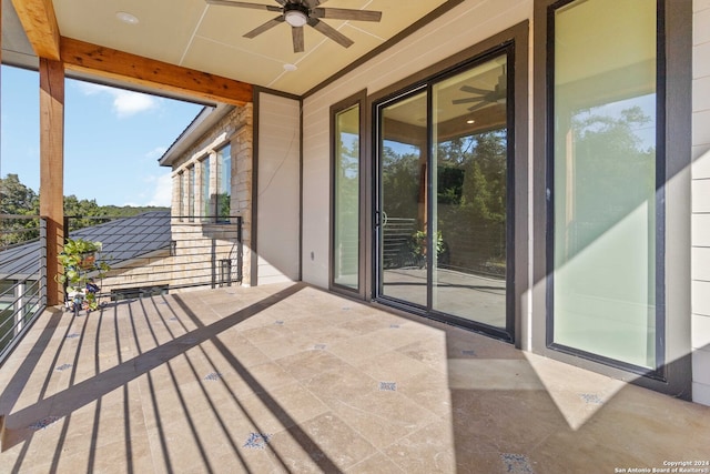 exterior space featuring ceiling fan