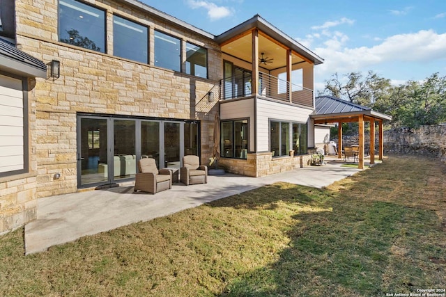 back of property with outdoor lounge area, a balcony, a patio area, a yard, and a gazebo