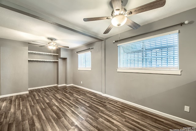 unfurnished bedroom with dark hardwood / wood-style flooring, a closet, and ceiling fan