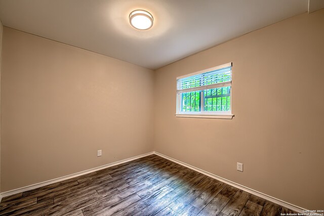 spare room featuring hardwood / wood-style floors