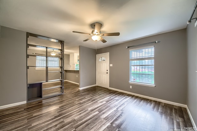 entrance foyer featuring ceiling fan and dark hardwood / wood-style flooring