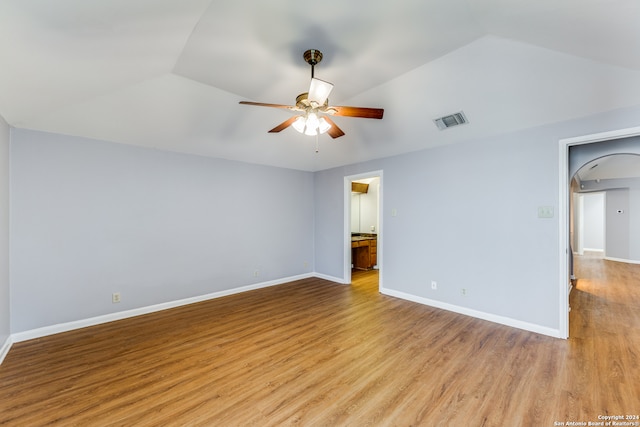 unfurnished room featuring vaulted ceiling, ceiling fan, and light hardwood / wood-style flooring