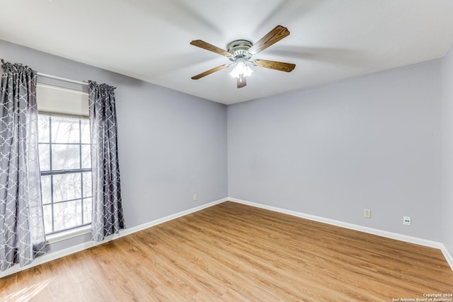 10311 Grand Cir, San Antonio, TX 78239 - unfurnished room with wood finished floors, ceiling fan, and baseboards