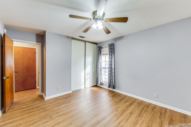 unfurnished room with light hardwood / wood-style floors and ceiling fan