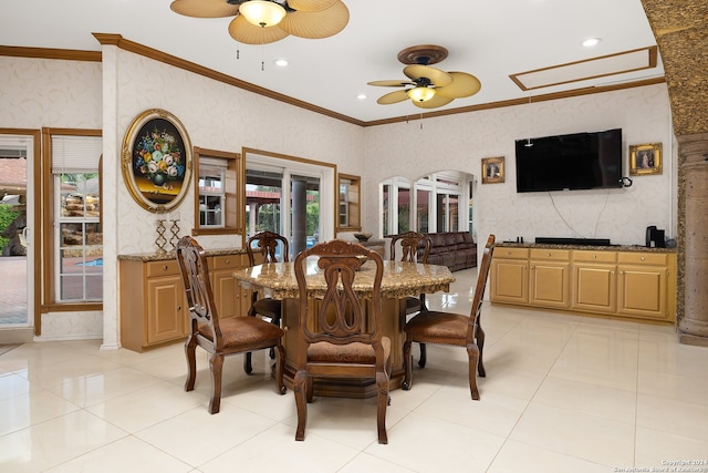 dining space with ceiling fan, crown molding, and light tile patterned flooring