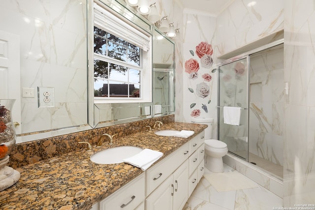 bathroom featuring vanity, toilet, and an enclosed shower