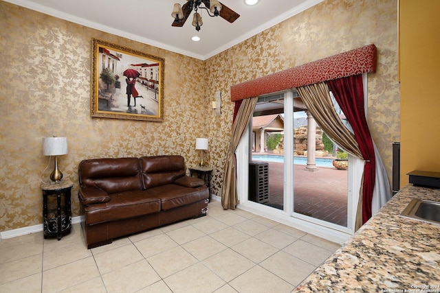 2301 Tanglewood, Weslaco, TX 78596 - living area featuring light tile patterned flooring, ornamental molding, baseboards, wallpapered walls, and ceiling fan