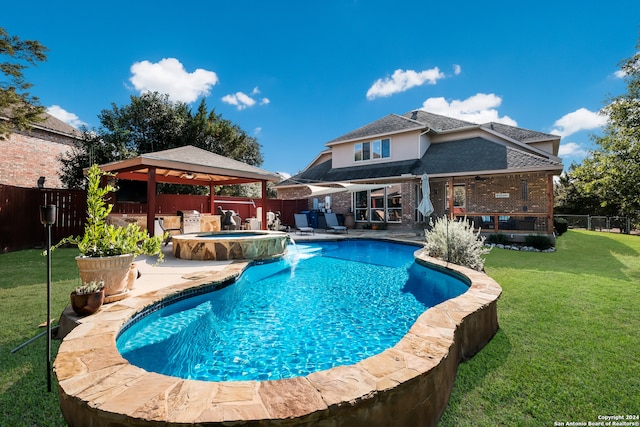 view of pool featuring an in ground hot tub, a patio, pool water feature, a yard, and a gazebo