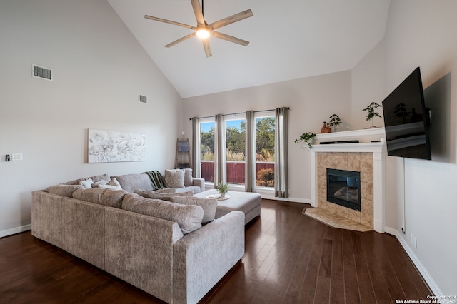 living room featuring a fireplace, dark hardwood / wood-style flooring, ceiling fan, and high vaulted ceiling