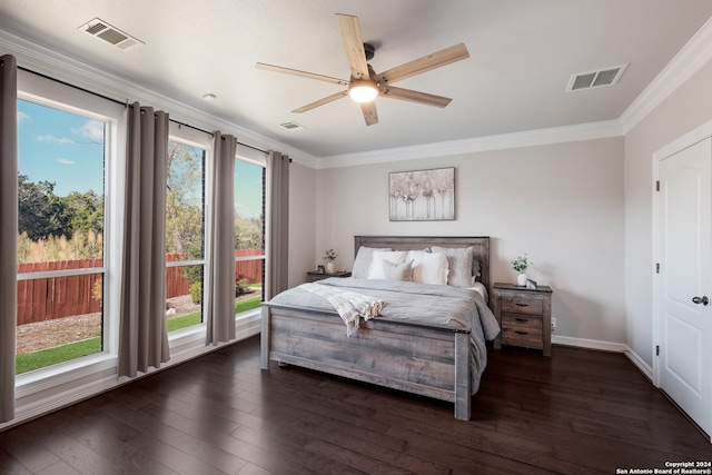 bedroom with dark wood-type flooring, ceiling fan, and crown molding