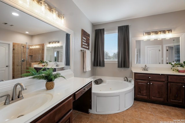 bathroom with shower with separate bathtub, vanity, and tile patterned flooring